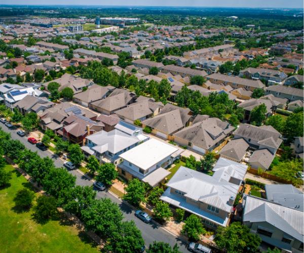 Aerial view of a residential neighborhood in Northern Virginia with well-kept lawns, trimmed trees, and consistent curb appeal.